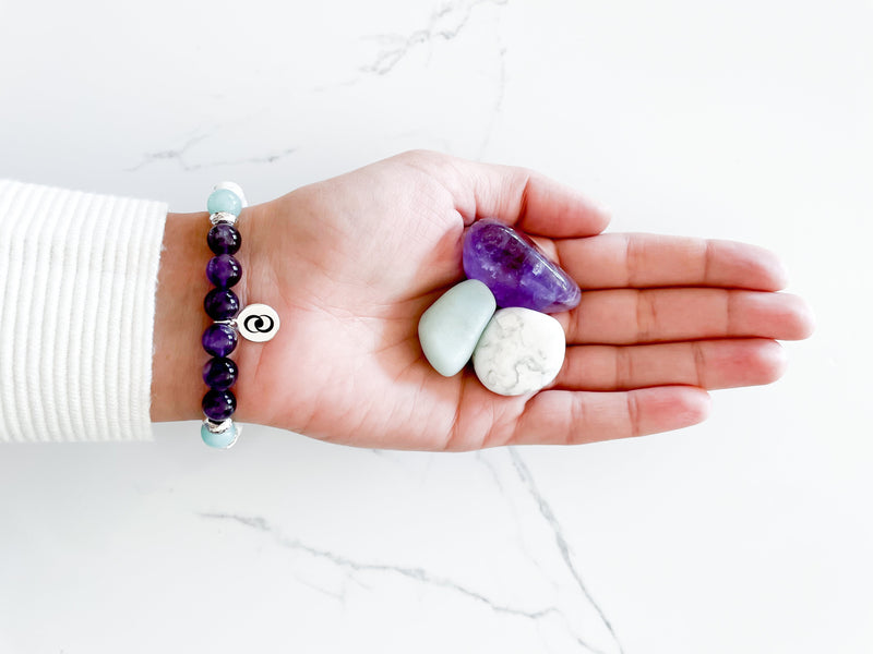 Healing crystal bracelet hand-made with amethyst, howlite, and amazonite.